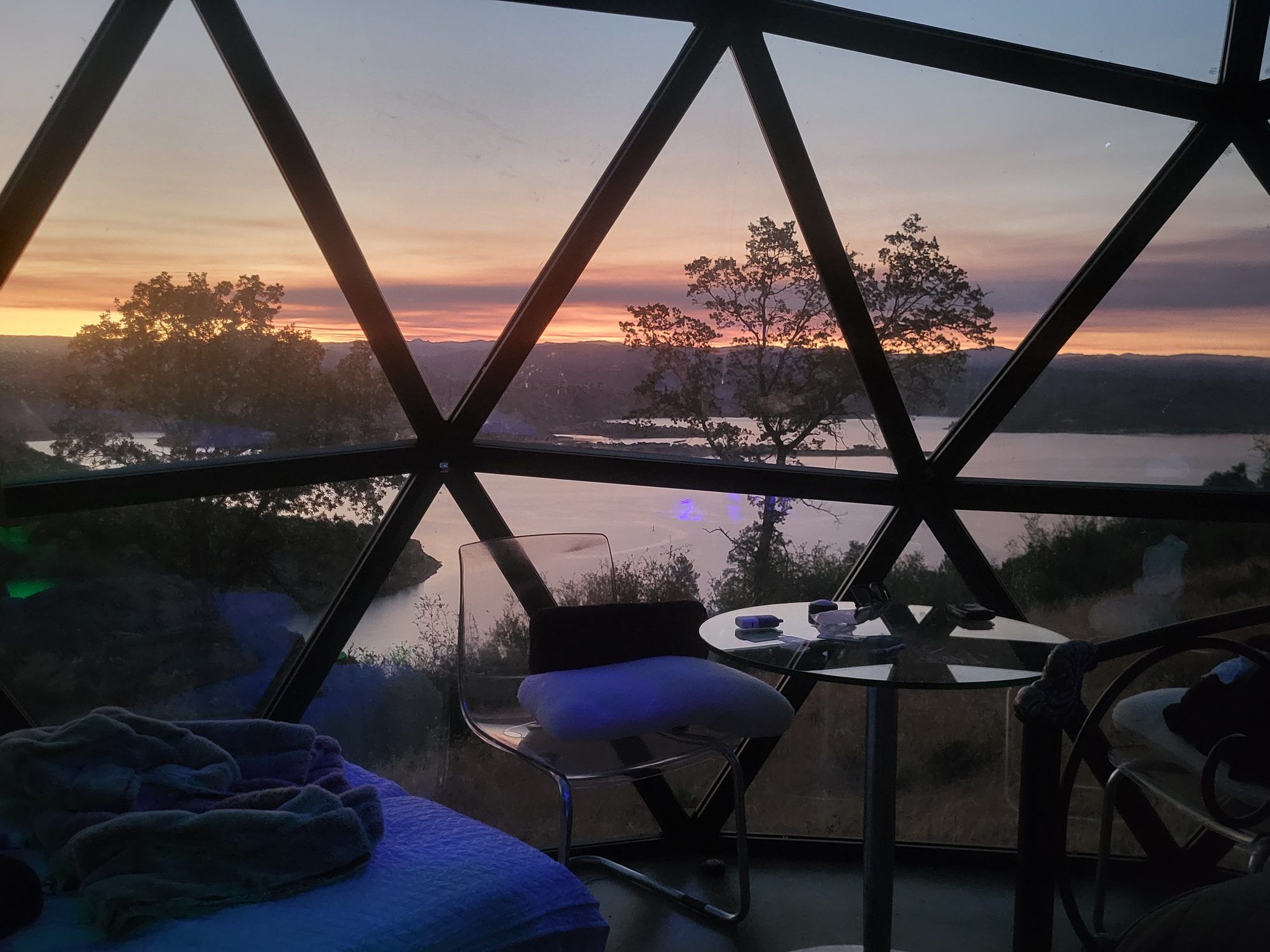 Sunset over the lake through the dome glass